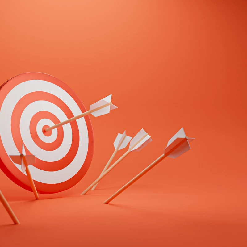 Abstracte weergave van een doel met daarop pijlen gericht, om te laten zien dat Lean dagstarts en weekoverleggen duidelijke KPI's en doelstellingen moeten hebben